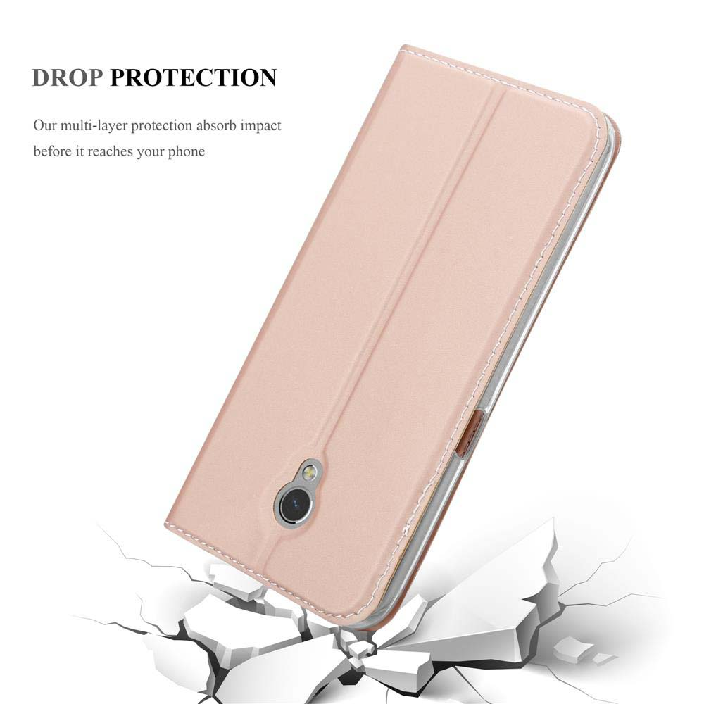 Una cover rosa per telefono poggia su un terreno crepato, mostrando la protezione anti-caduta.