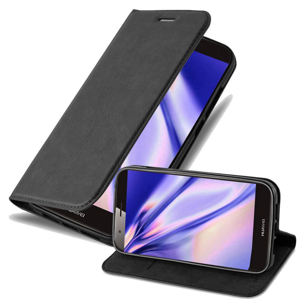Un teléfono negro con funda abierta y otro teléfono al lado.