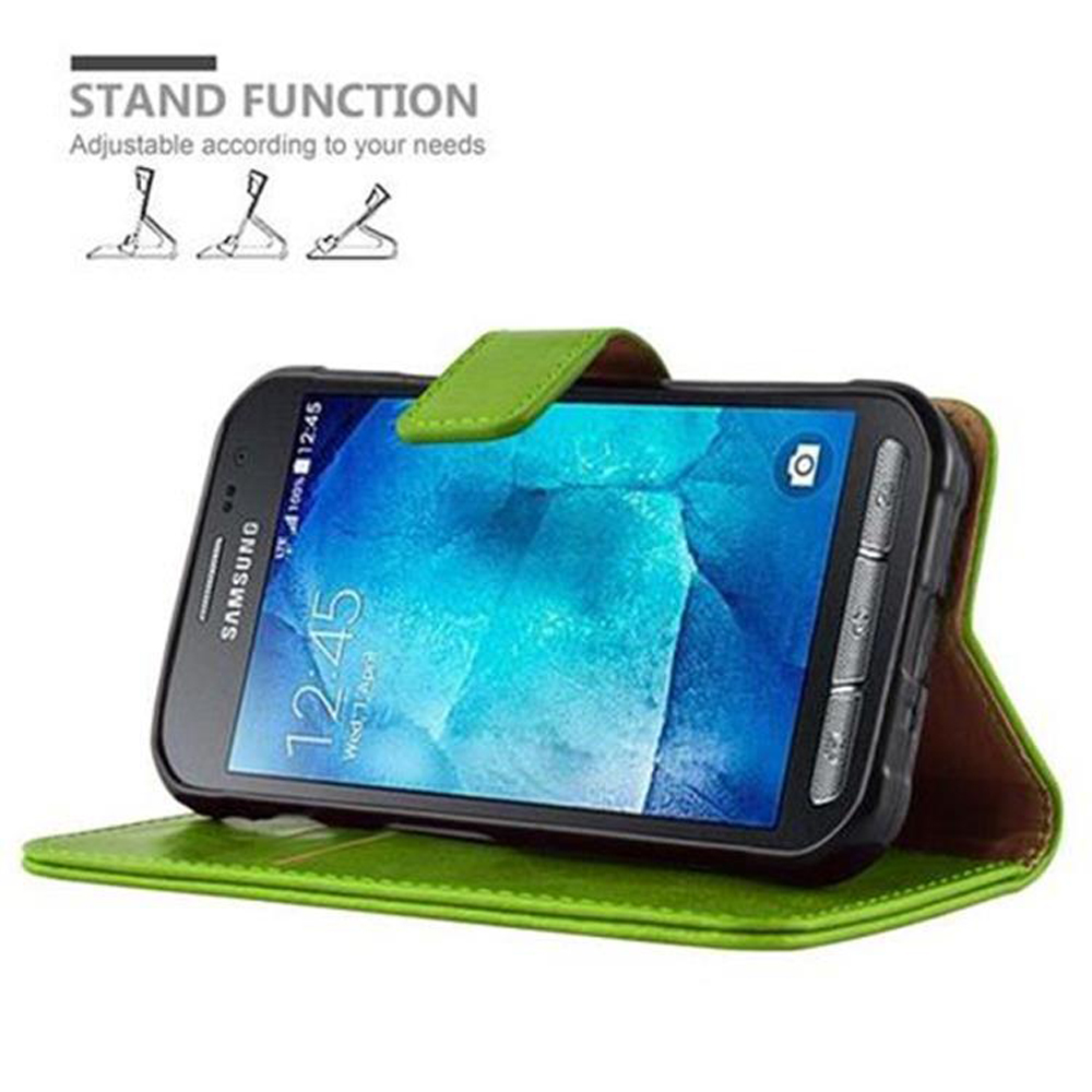 Custodia a portafoglio verde con telefono Samsung acceso, ore 12:45.