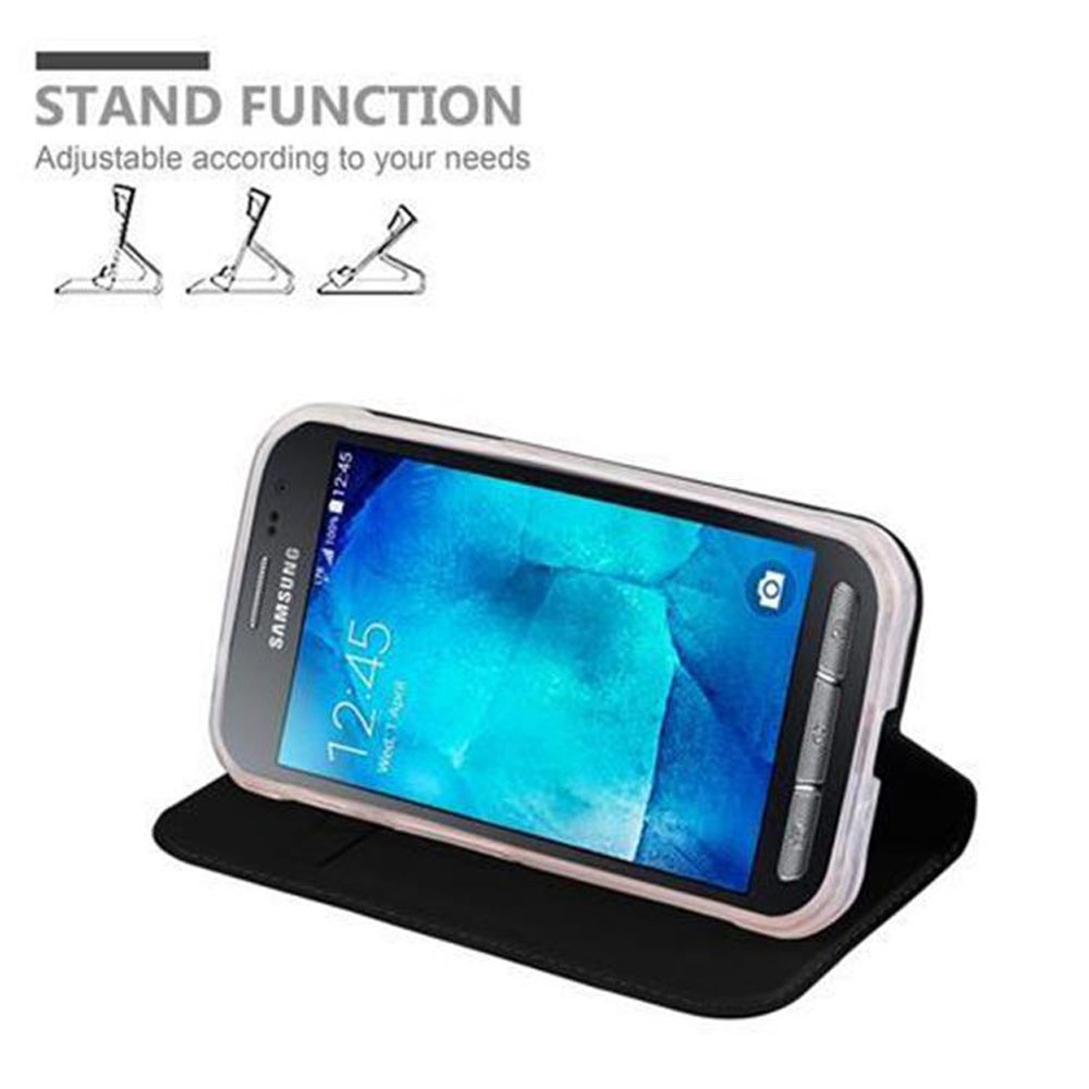 Uno smartphone in una custodia nera sta in piedi.
