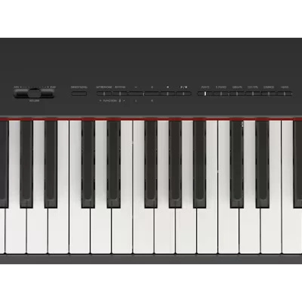 Zbliżenie czarnej klawiatury pianina elektronicznego z czerwonymi akcentami.