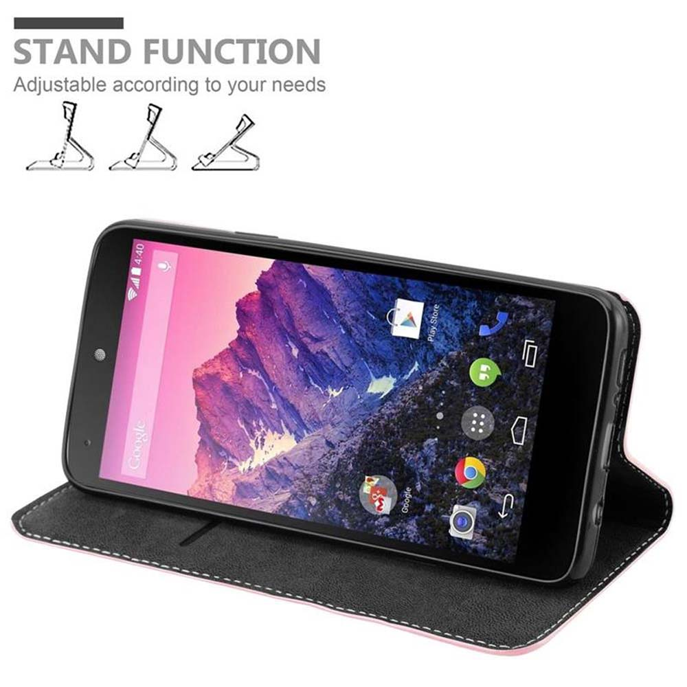 Teléfono inteligente negro en funda rosa, apoyado en modo horizontal.