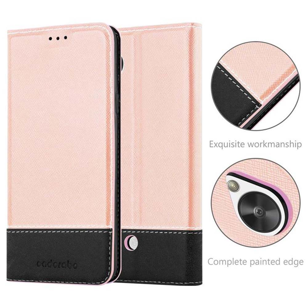 Una funda tipo libro rosa para teléfono con ribete y costuras negras.