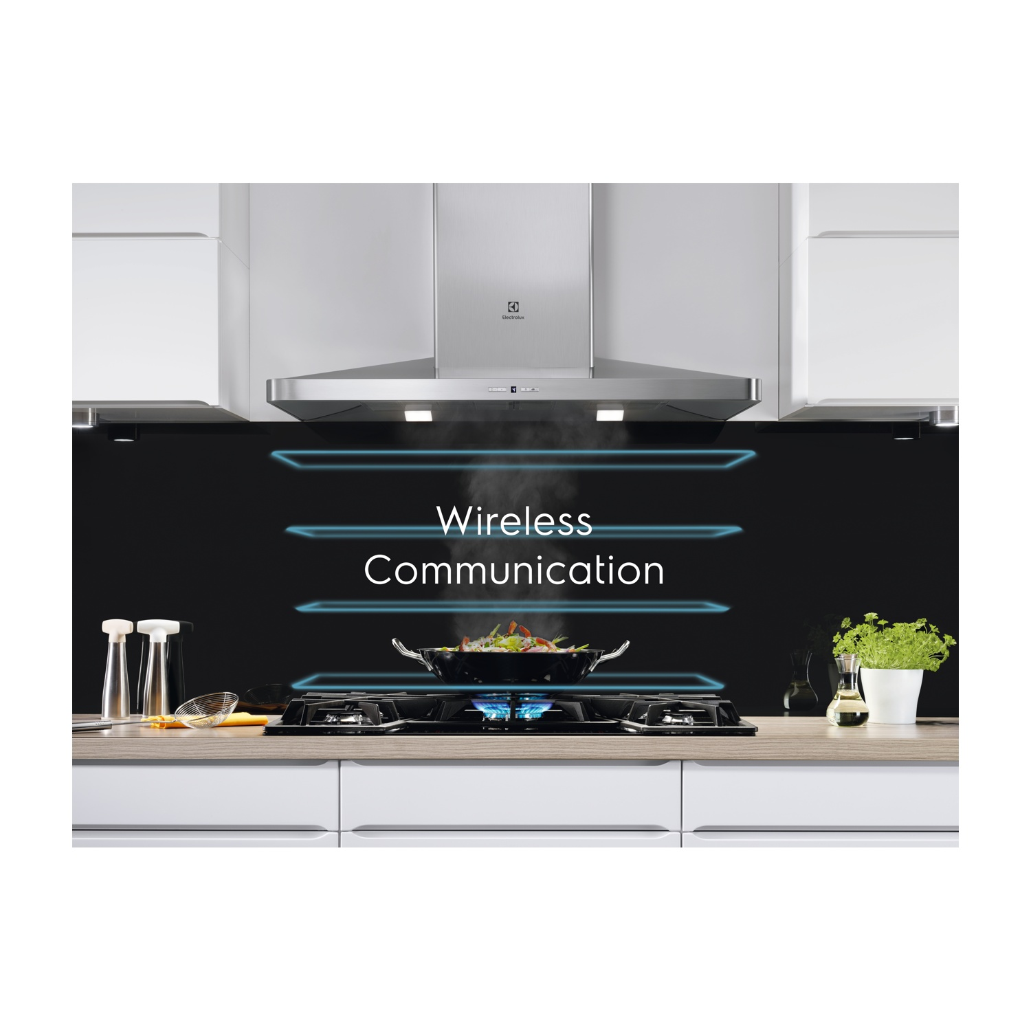 Gotowanie na kuchence gazowej z okapem i napisem "Wireless Communication".