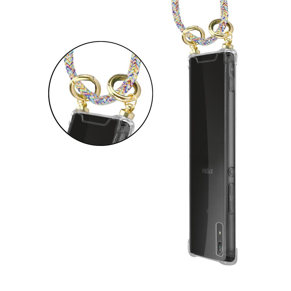 Transparente Handyhülle mit buntem Band und goldenen Ringen, die an einem Smartphone befestigt sind.
