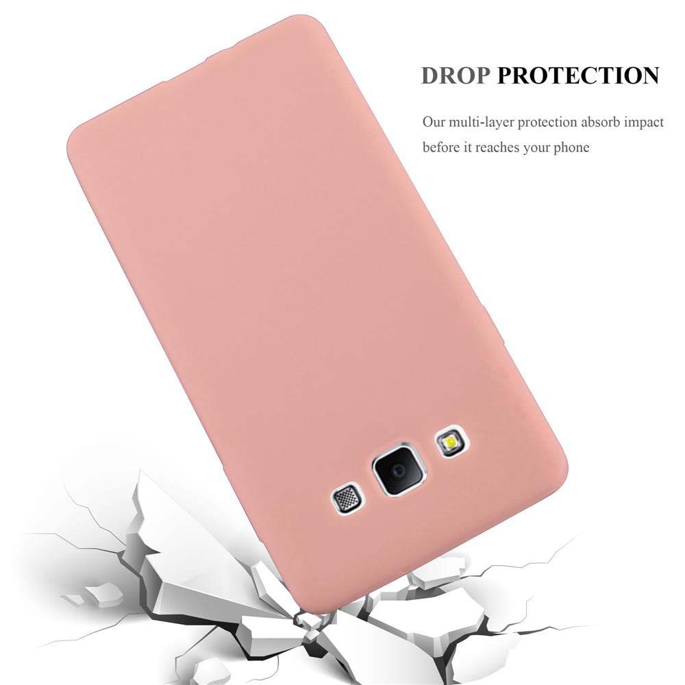 Ein rosafarbener Handy-Schutz fällt auf zerbrochene weiße Oberflächen.