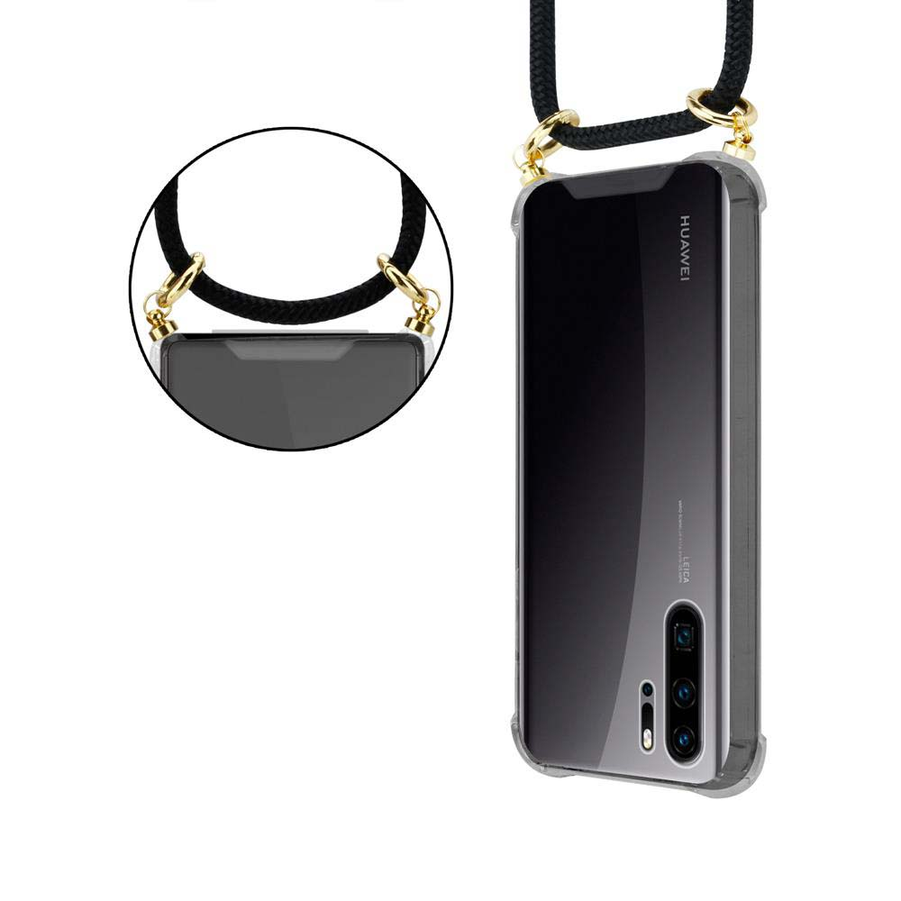 Una custodia trasparente per telefono con cordino nero e hardware dorato, avvolta attorno a un telefono.
