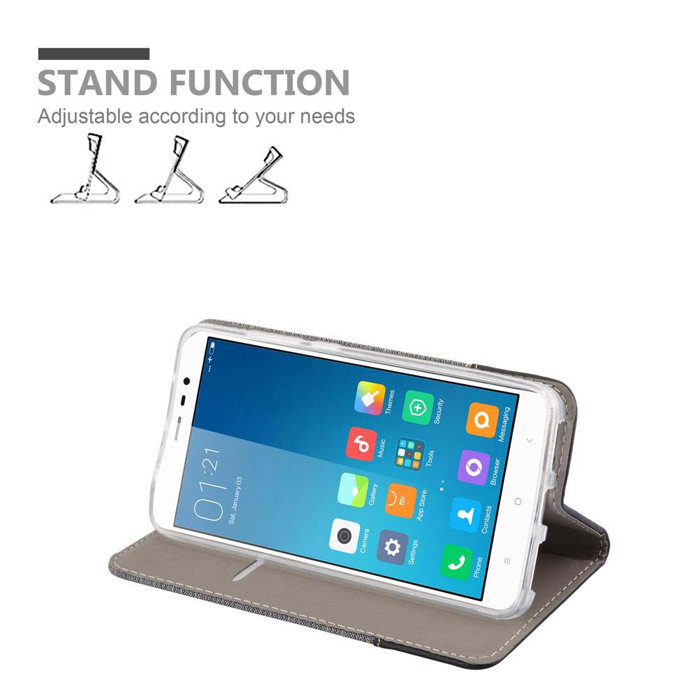 Ein Smartphone in einer Hülle mit Standfunktion, daneben drei Ständer.
