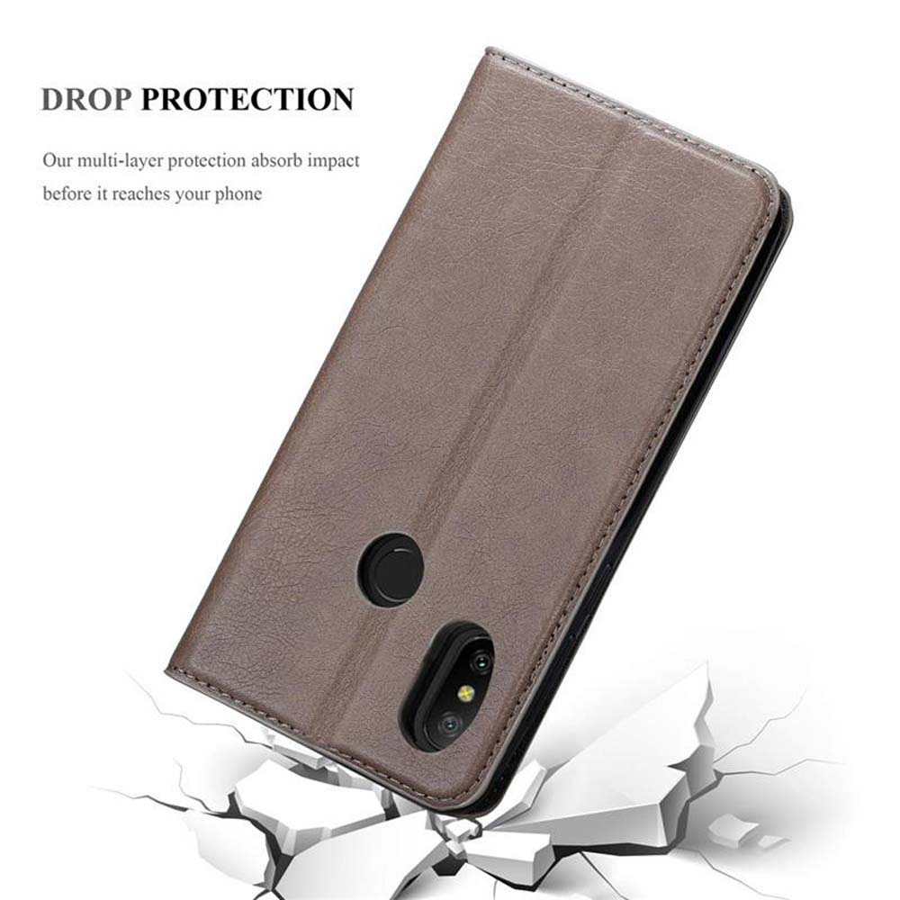 Custodia in pelle marrone che simula una caduta. Testo "DROP PROTECTION".