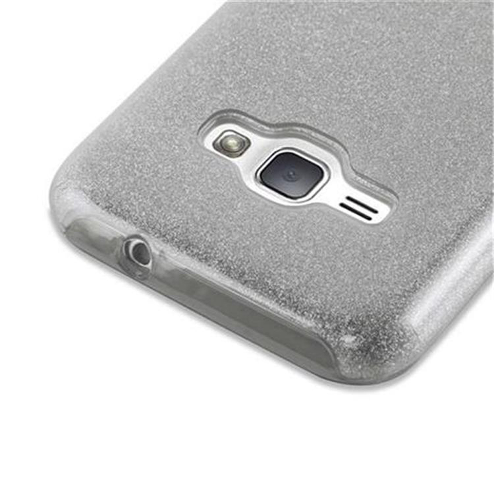 Graues Handy mit Glitzerhülle, Kameraobjektiv und Ladeanschluss.