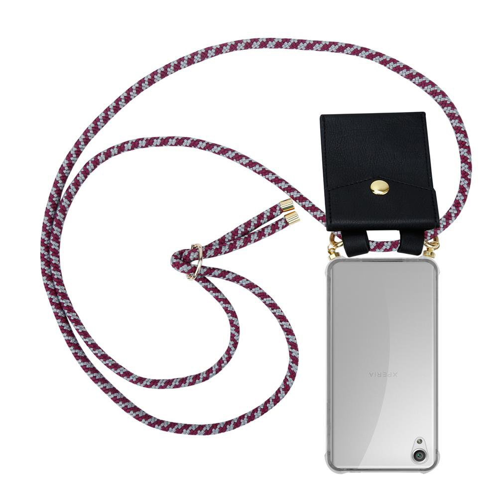 Ein Smartphone mit einer schwarzen Tasche und einer Kordel daran.
