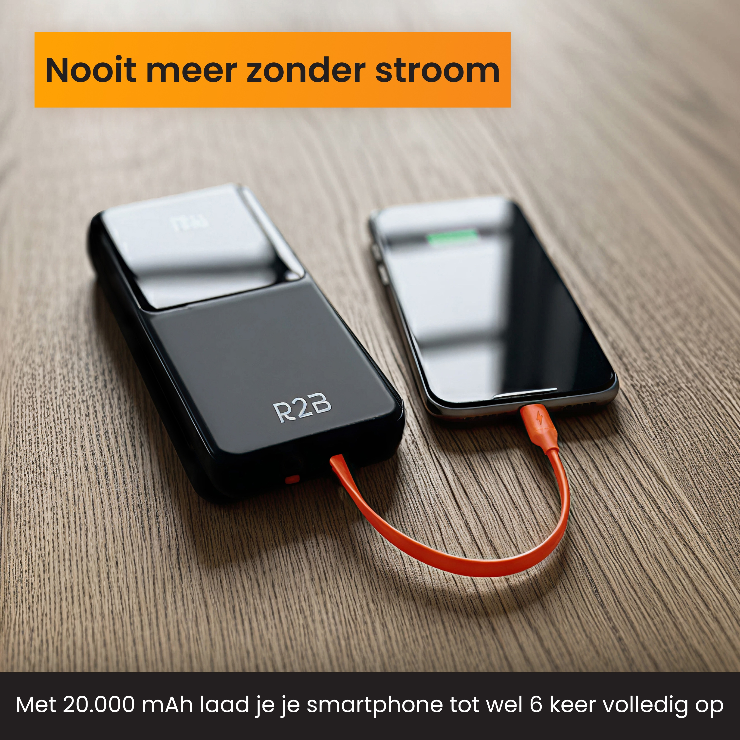 Ein schwarzes Powerbank lädt ein Smartphone über ein oranges Kabel auf.