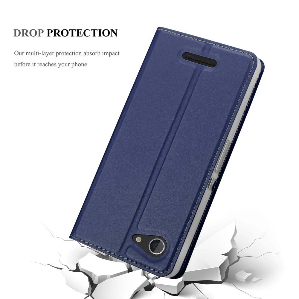 Custodia blu per telefono con protezione anticaduta, su terreno crepato.