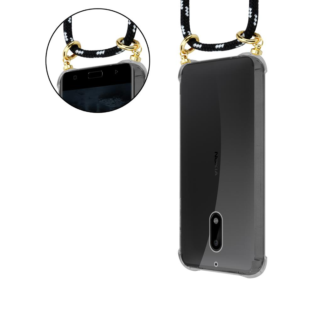 Ein transparentes Nokia-Handy mit schwarzem Band, das an goldenen Ringen befestigt ist.