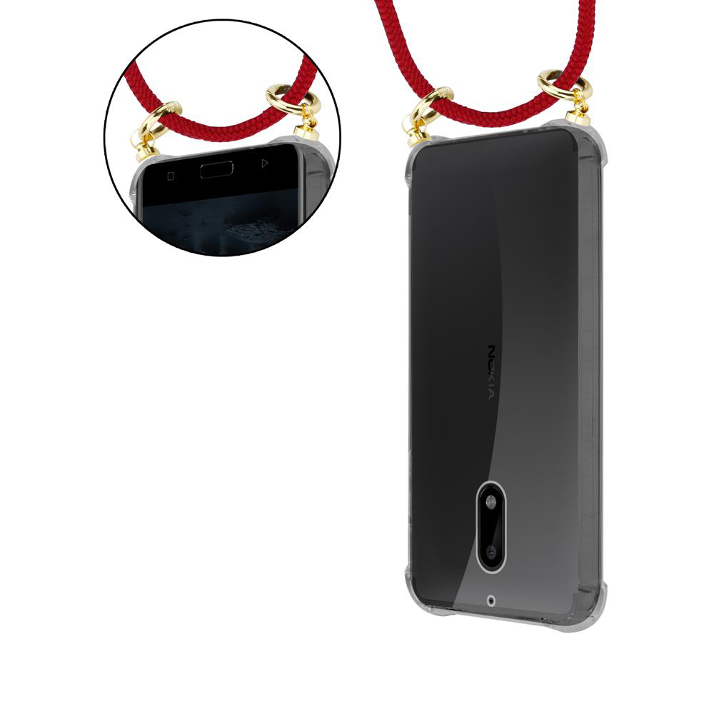 Ein transparentes Nokia-Handy mit einem roten Lanyard, das an den Ecken befestigt ist.