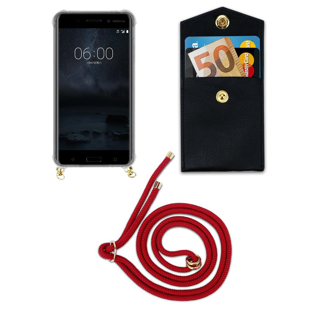 Smartphone mit rotem Band, schwarzer Tasche mit Karten und Geldschein.