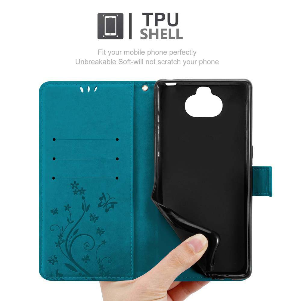 Una custodia a libro verde acqua con accenti di farfalla e guscio in TPU nero.