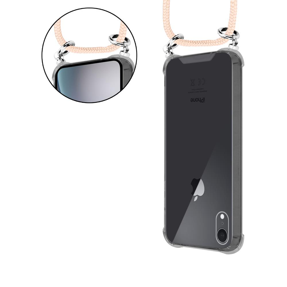 Ein transparentes Handyhülle mit einem hellbeigen Band, das an Metallringen befestigt ist.