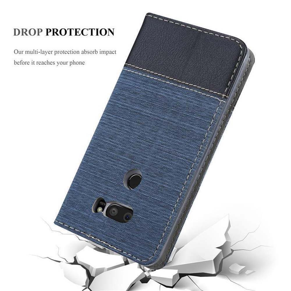 Blaues Handycover mit schwarzem Leder oben, auf zerbrochenem Weiß.