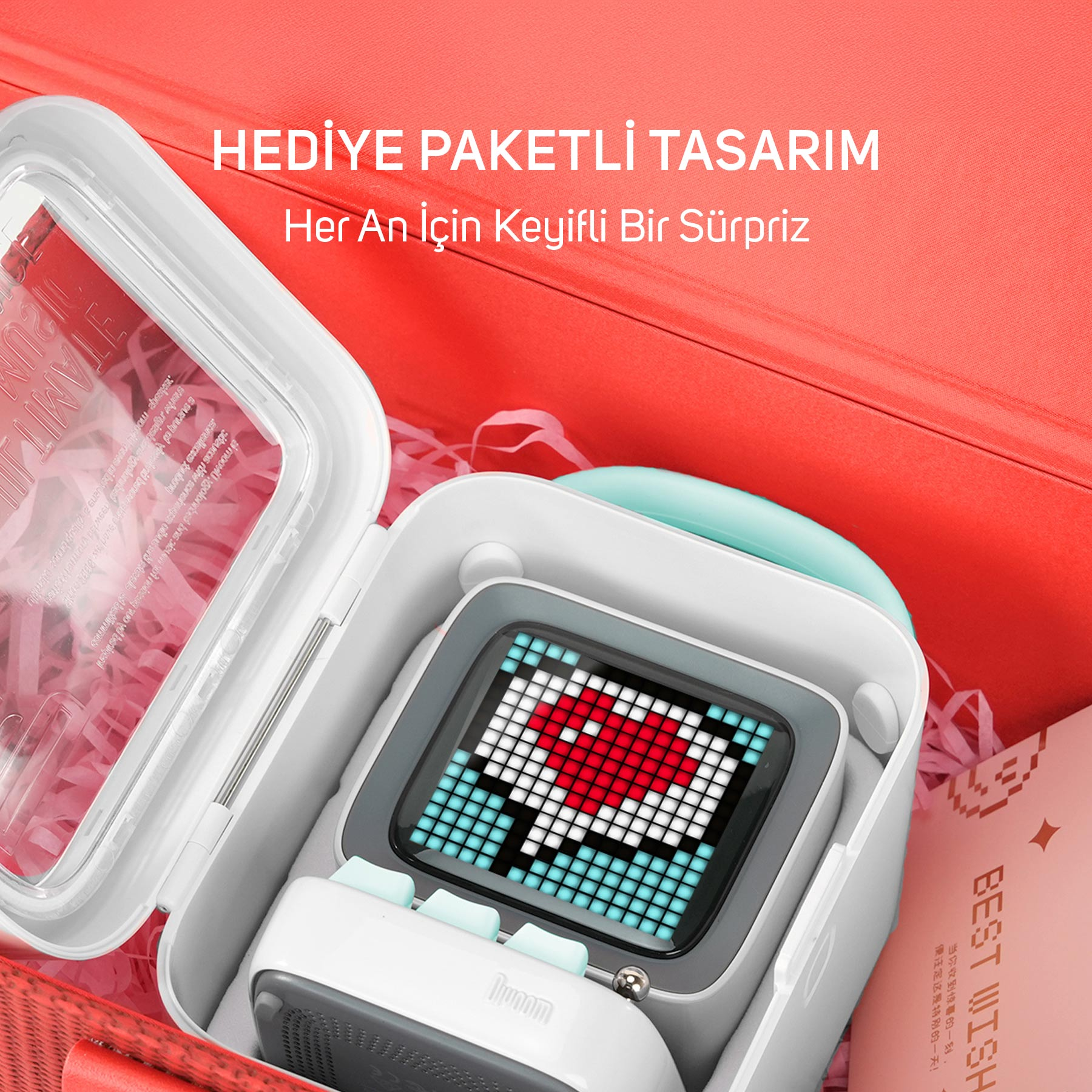 Białe urządzenie z wyświetlaczem serca z pikseli w otwartym czerwonym pudełku.