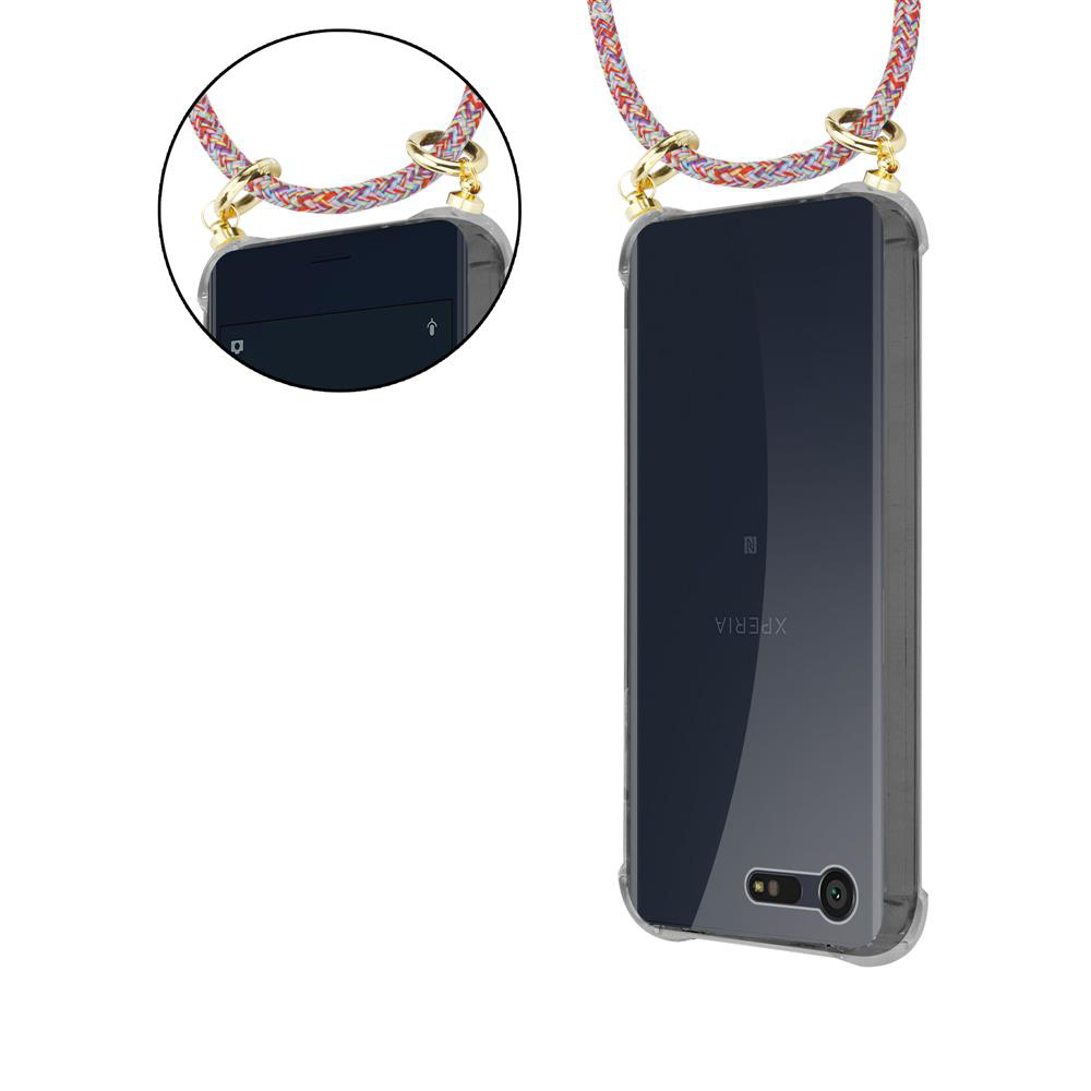 Funda transparente para móvil con cordón trenzado y herrajes dorados.