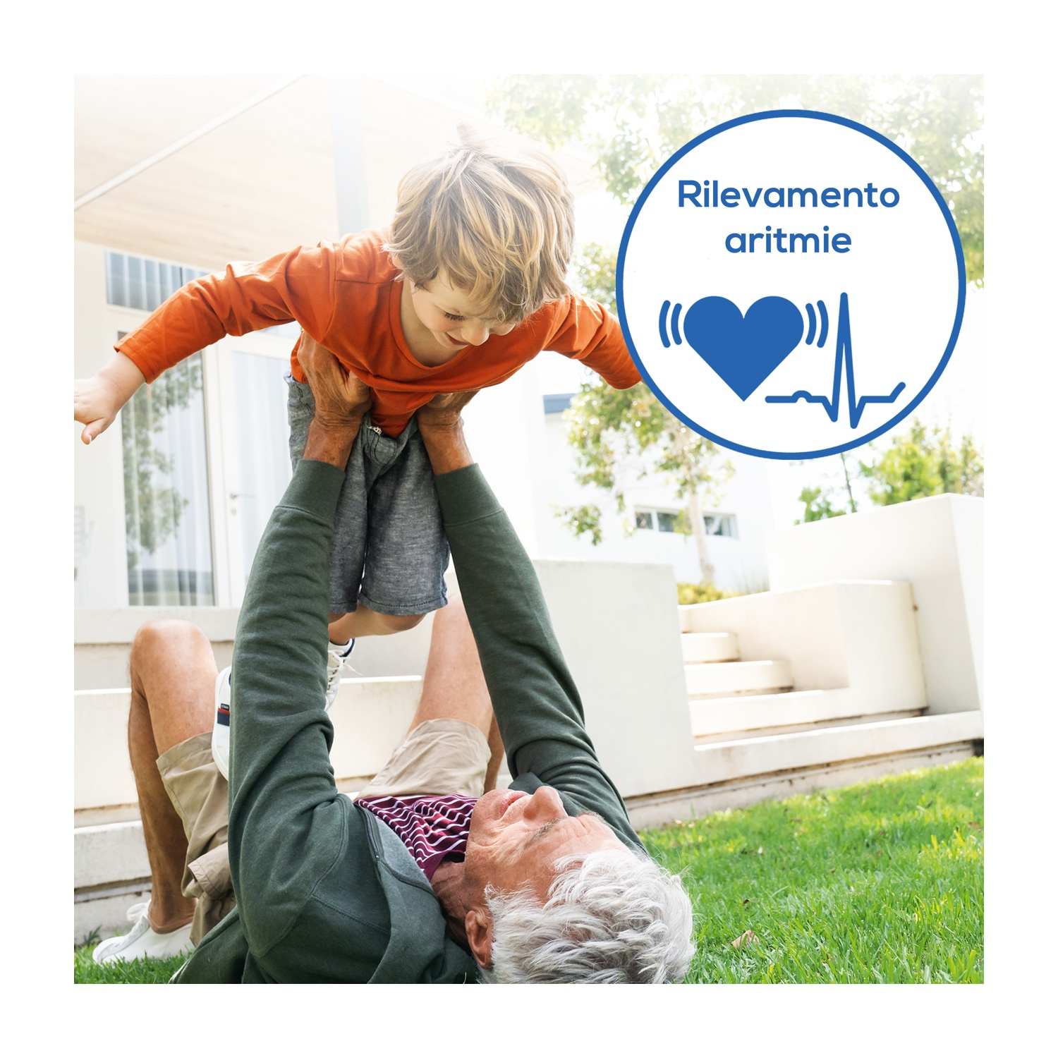 Mężczyzna leży na trawie, podnosząc dziecko. Symbol serca z EKG.