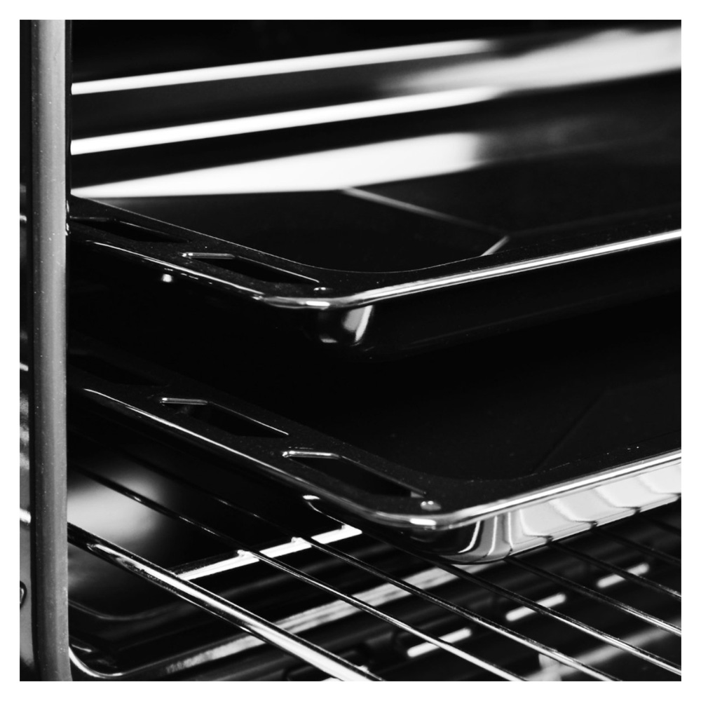Close up of two shiny baking trays inside an oven rack.