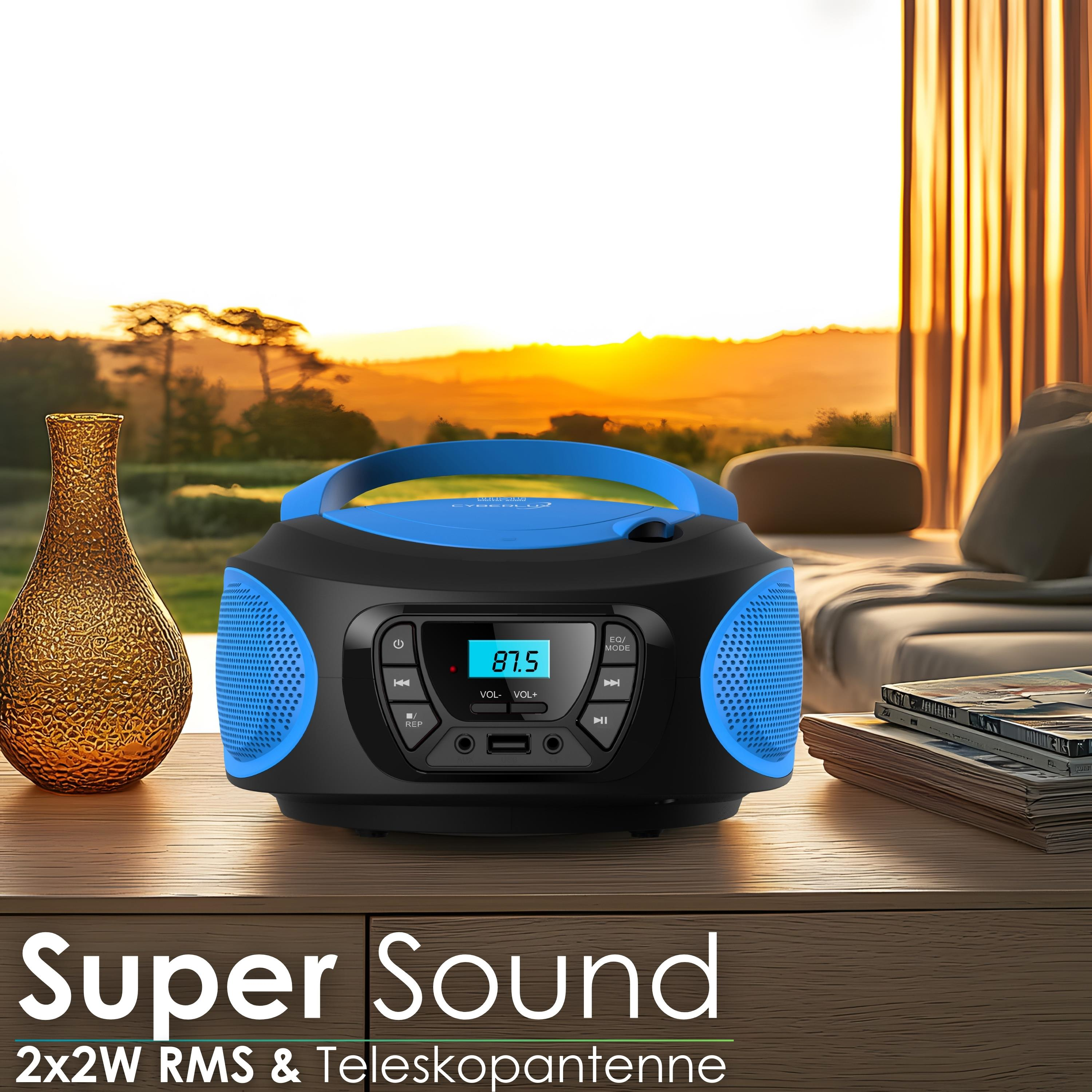 Ein blauer CD-Player mit Lautsprechern steht auf einem Tisch.