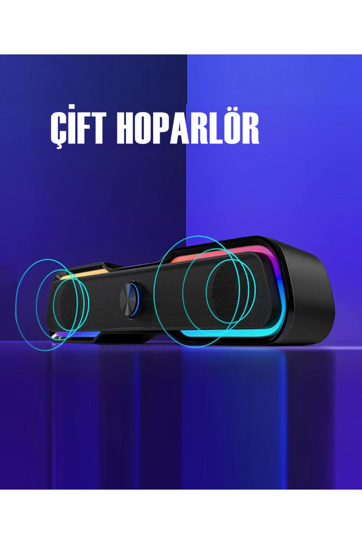 Czarny głośnik z niebieskimi kręgami światła, podświetlony kolorami tęczy.