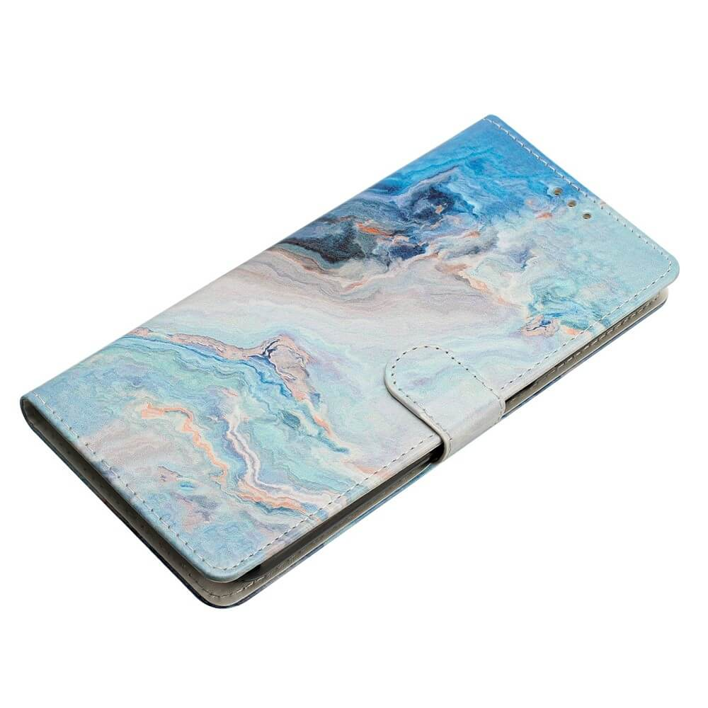 Custodia per telefono con motivo marmorizzato blu e verde acqua.