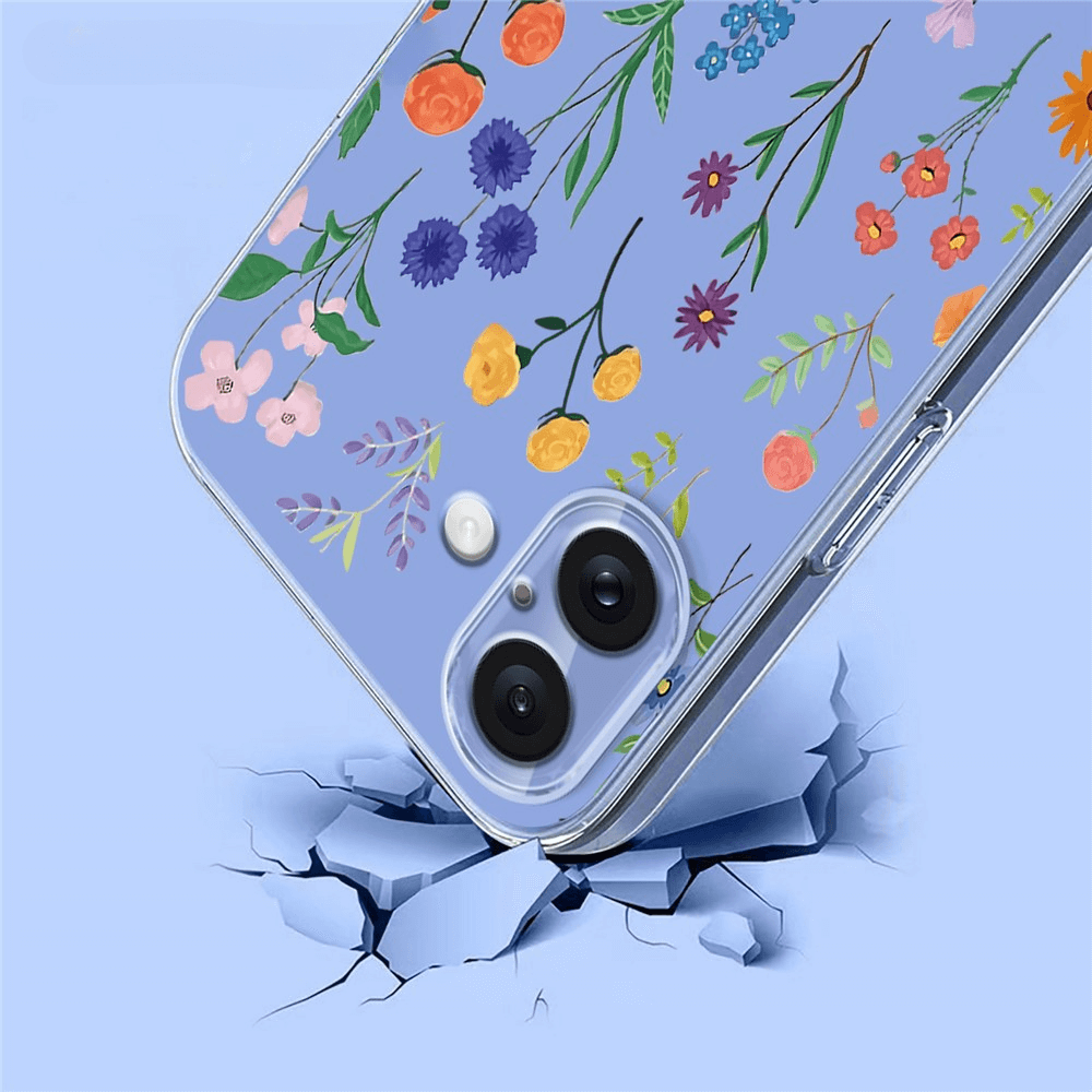 Coque de téléphone transparente à motif floral tombant sur une surface craquelée.