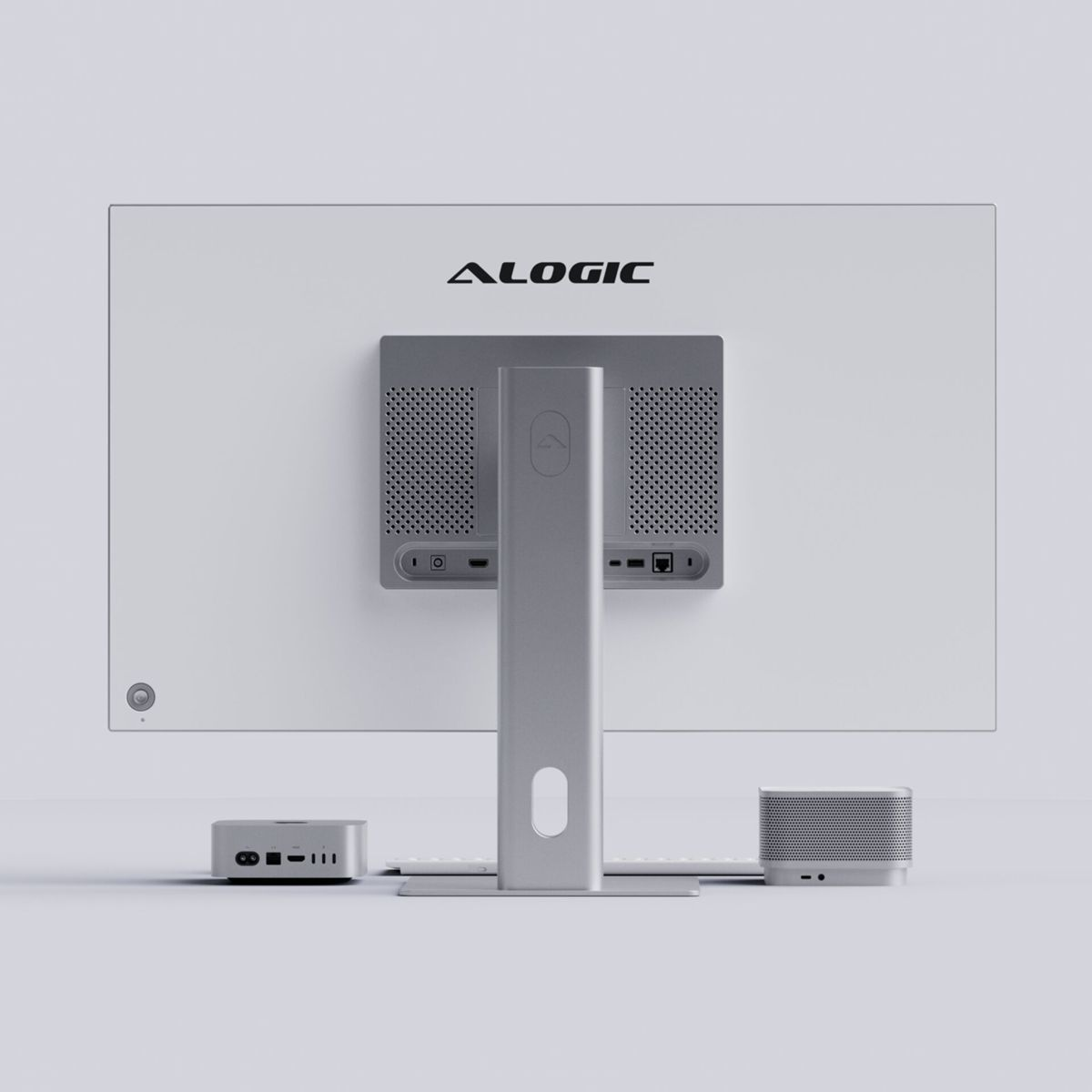 Rückseite eines weißen Monitors mit Alogic-Logo, silbernem Ständer, Mini-PC und Lautsprecher.
