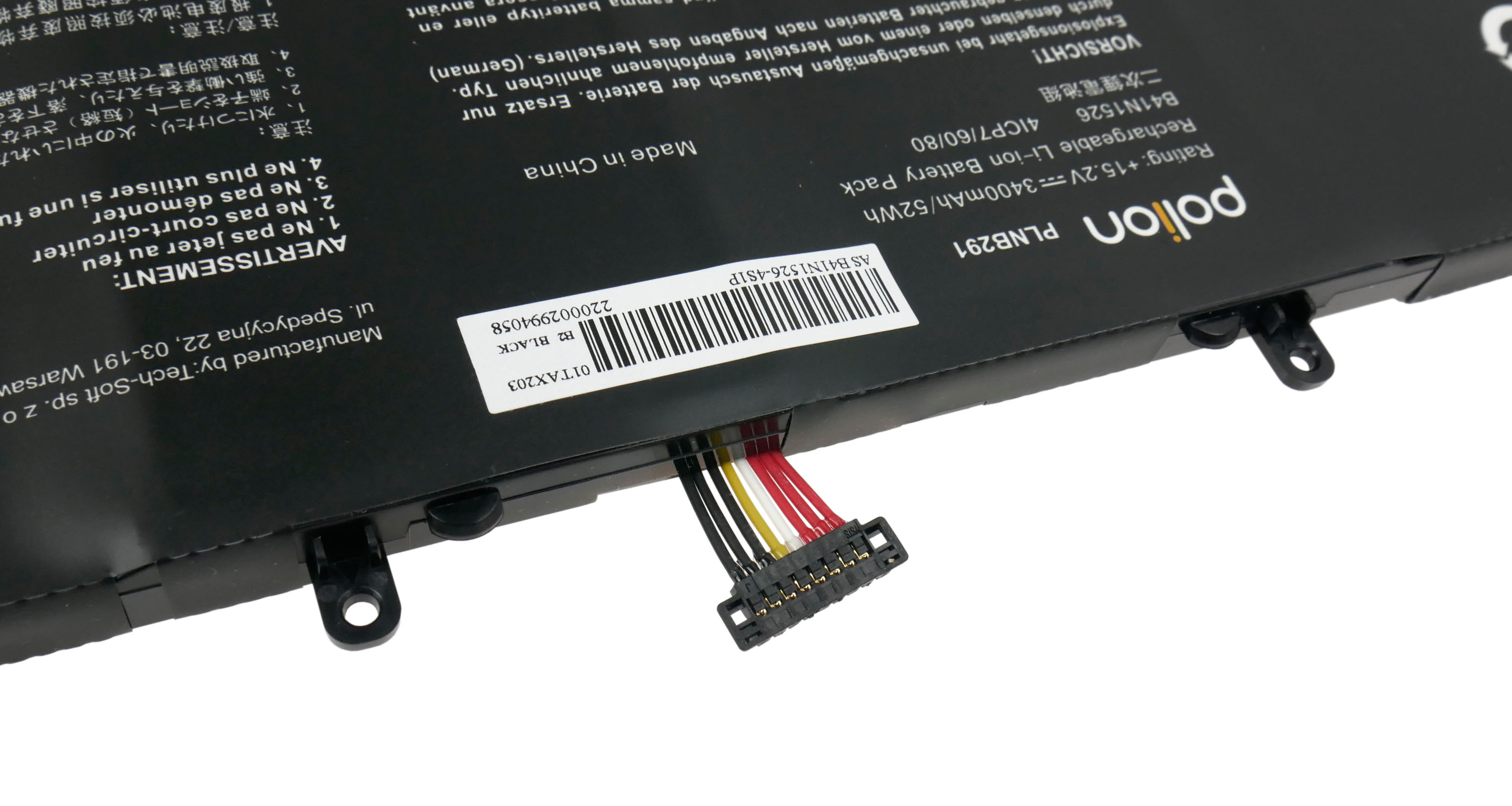 Czarny akumulator do laptopa z kablami i etykietą. Wyprodukowano w Chinach.