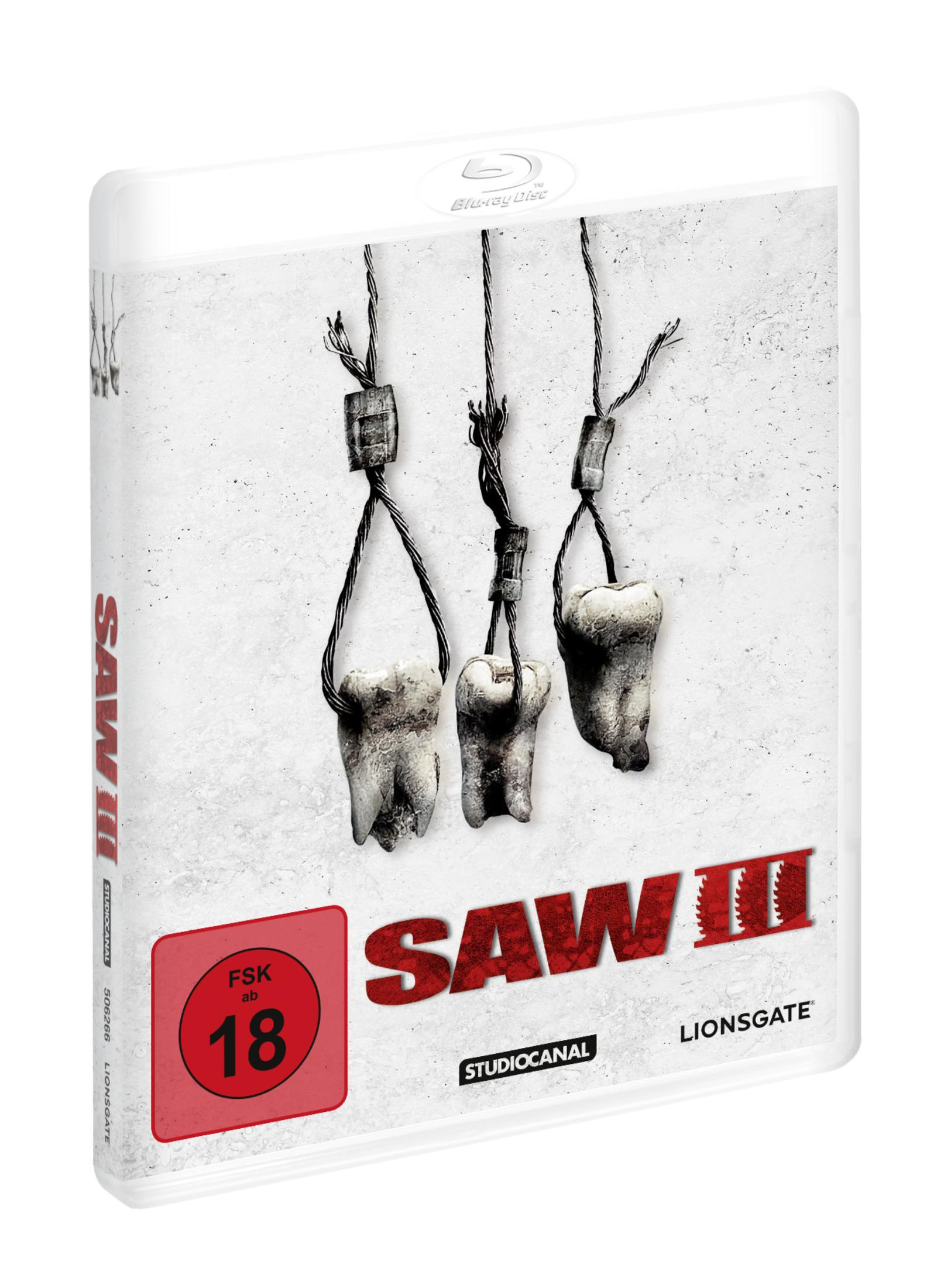 Tre denti appesi a fili su sfondo bianco. Copertina di Saw II.