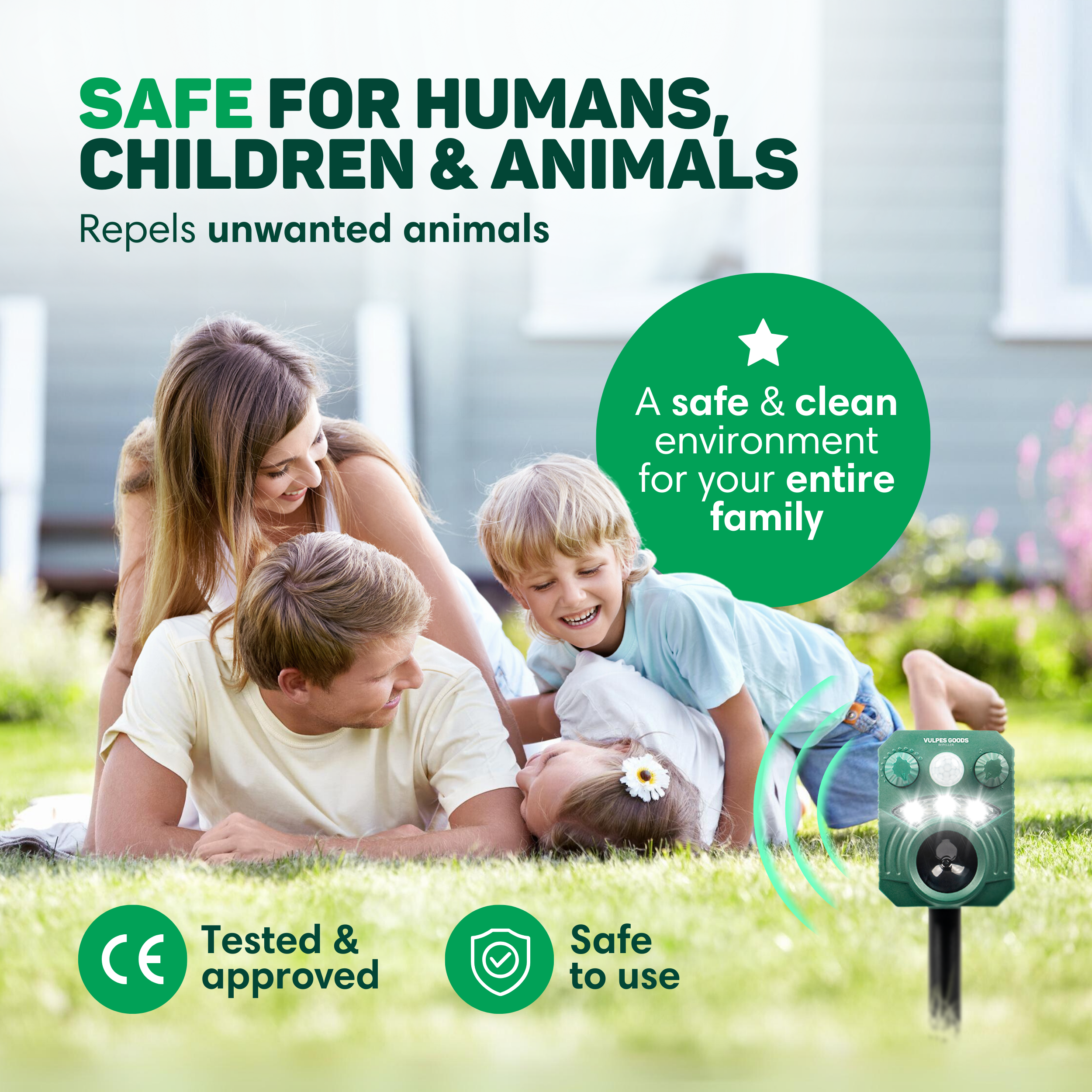 Familie im Gras, ein Tiervertreiber im Vordergrund. Sicher für alle.