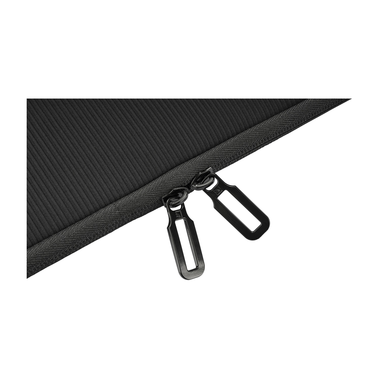 Close-up of black fabric with two black zipper pulls.