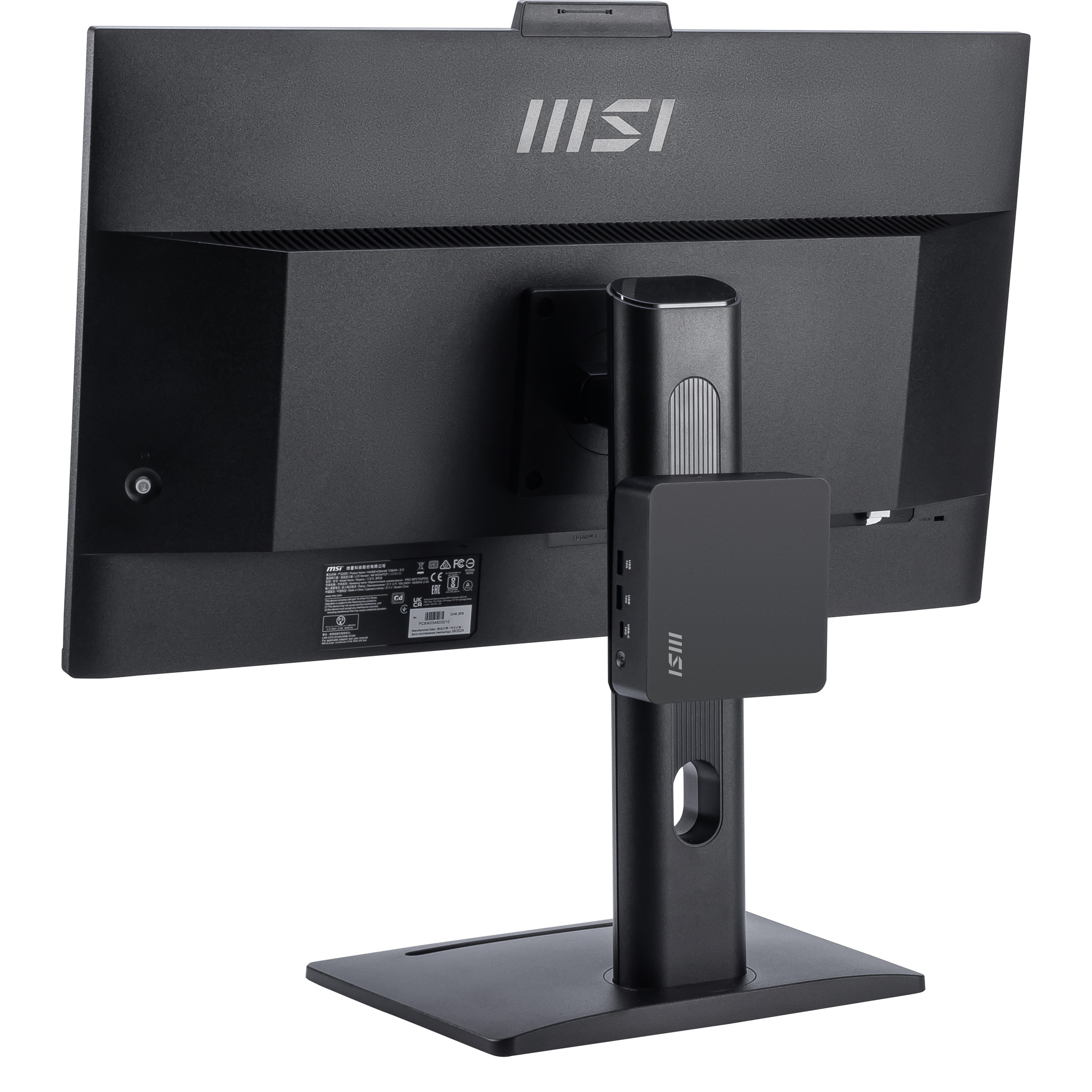 Tył czarnego monitora MSI z małym czarnym mini PC przymocowanym do stojaka.