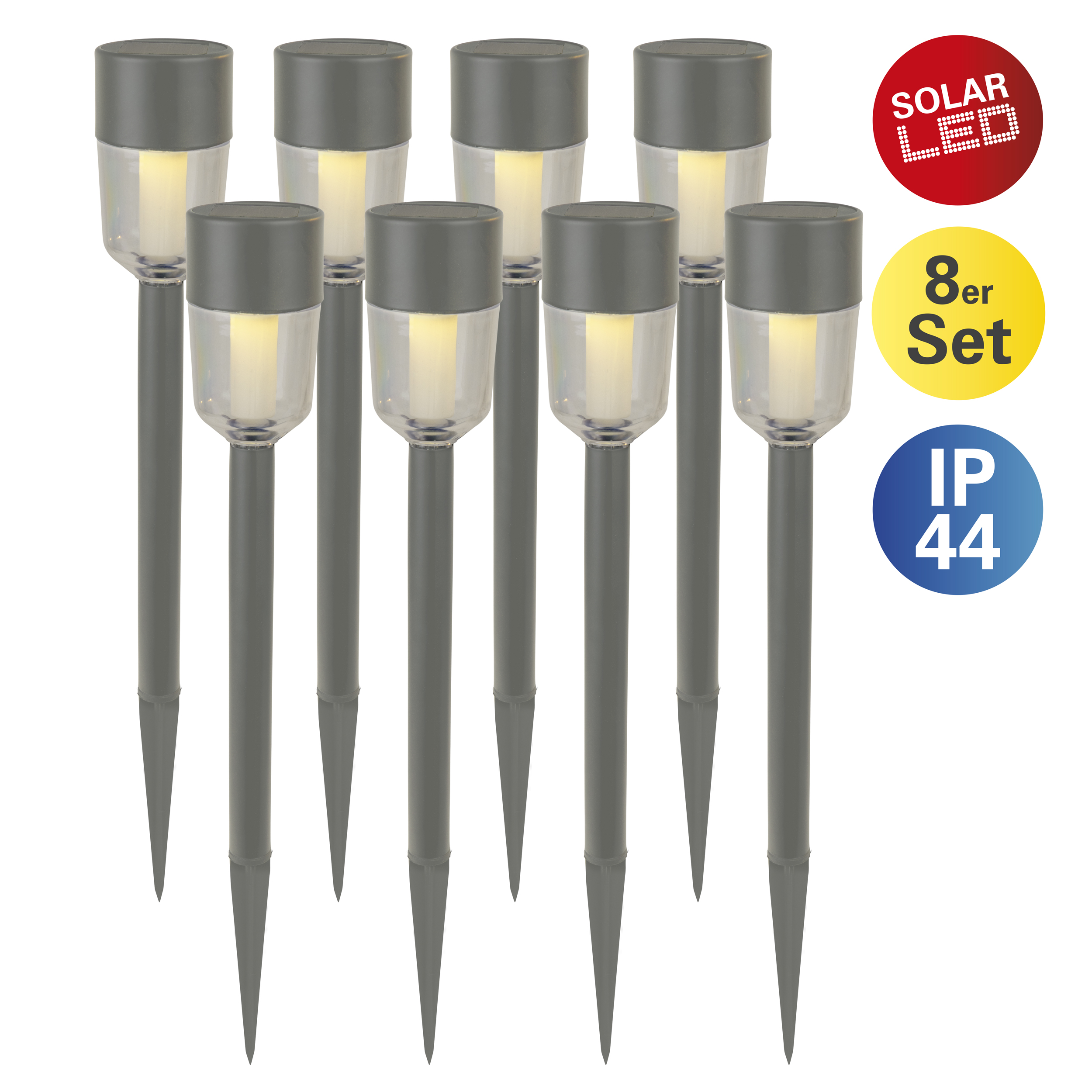 A set of eight grey solar-powered garden lights with clear tops.