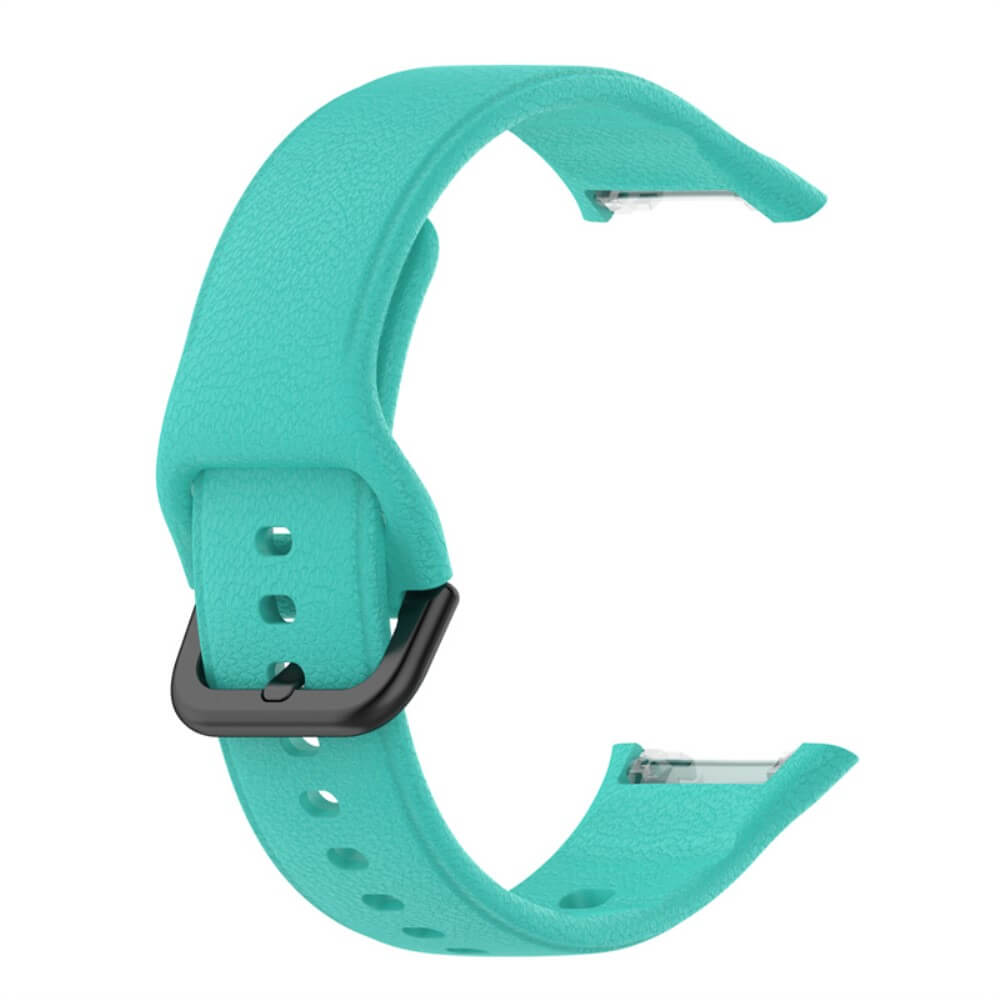 Un bracelet de montre turquoise avec boucle noire et trous.