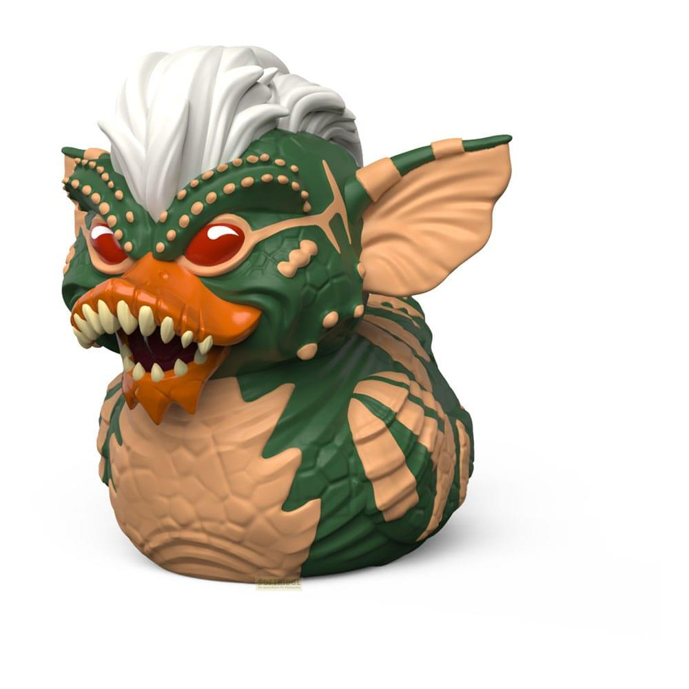 Grüner Gremlin-Gummitier mit weißen Haaren, roten Augen und geöffnetem Mund.