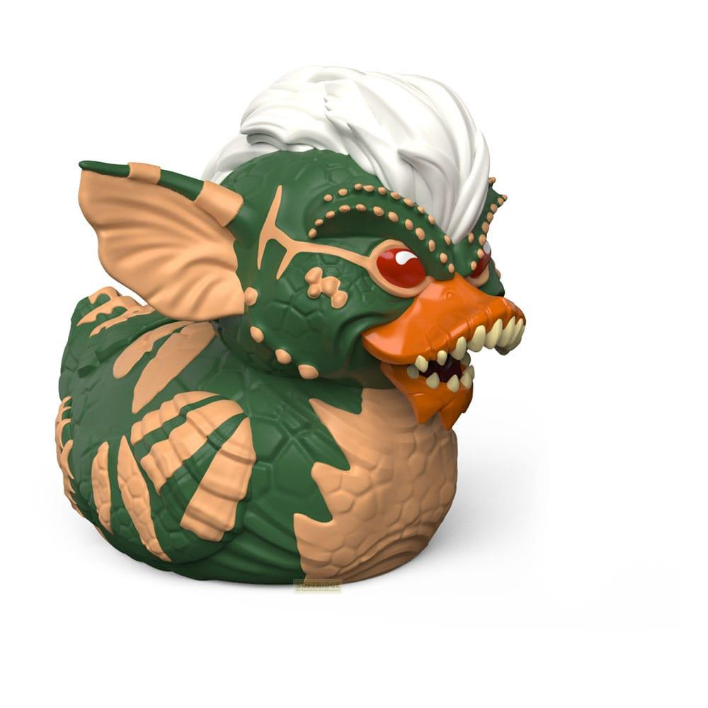 Grüne Gummiente mit orangefarbenem Schnabel, Reißzähnen und weißen Haaren. Design einer fiktiven Figur.