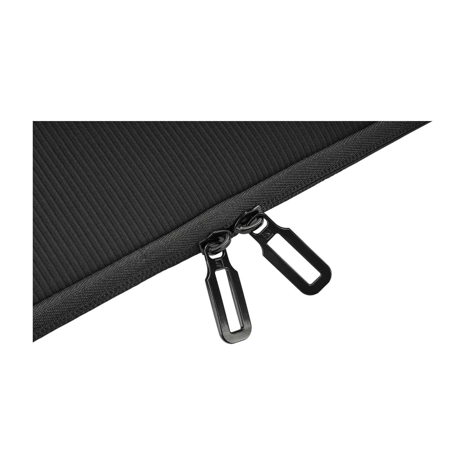Close-up of black ribbed fabric with two black zipper pulls. White background.
