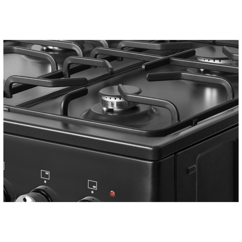 Close-up of a black gas stove with metal grates and a burner.