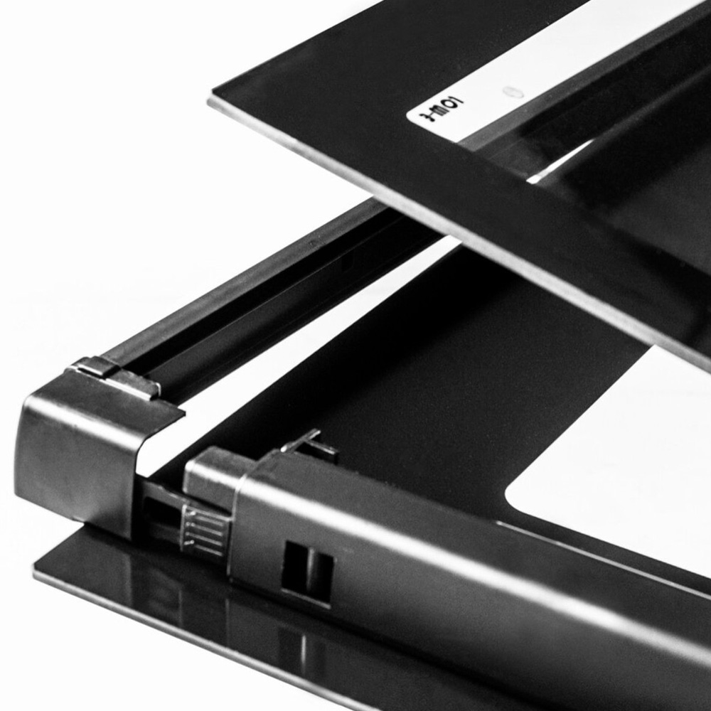 Close-up of a black scanner with its lid open.