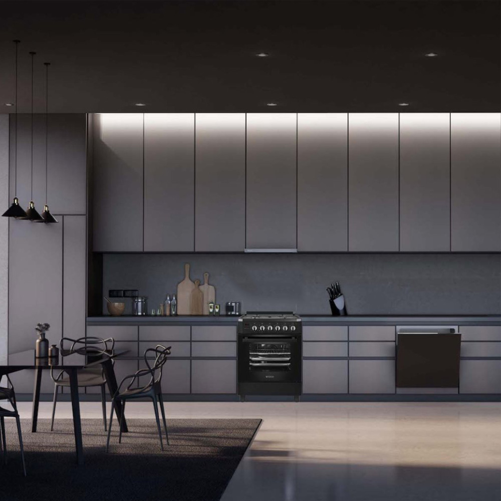 Modern kitchen with black stove, grey cabinets, and dining table.