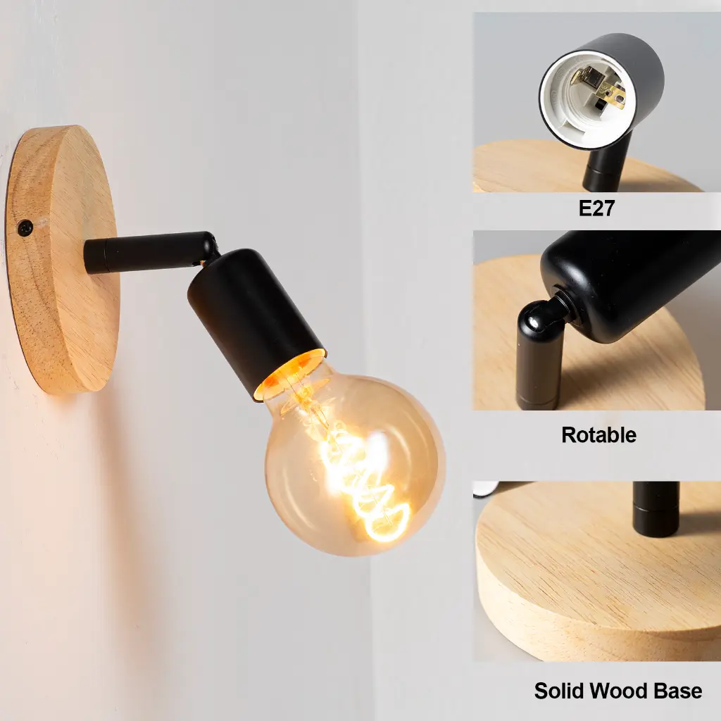 Una lámpara de pared con base de madera, brazo negro y bombilla Edison.