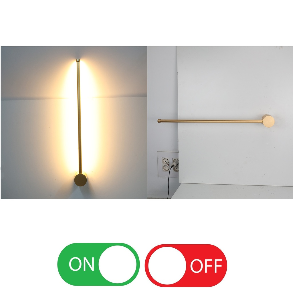 Una lámpara de pared dorada iluminada, junto a otra apagada. Un interruptor abajo.