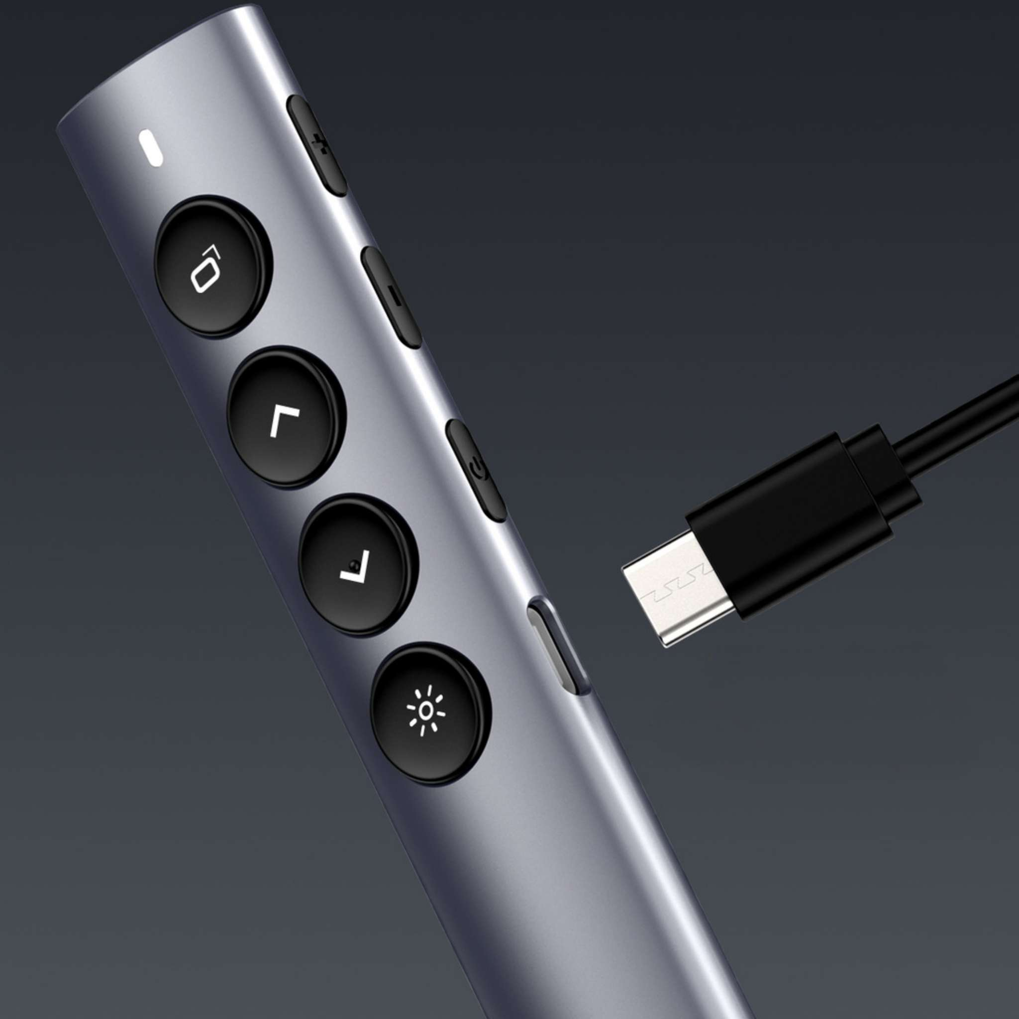 Grauer Stift mit schwarzen Tasten und einem USB-C-Kabel, das angeschlossen wird.