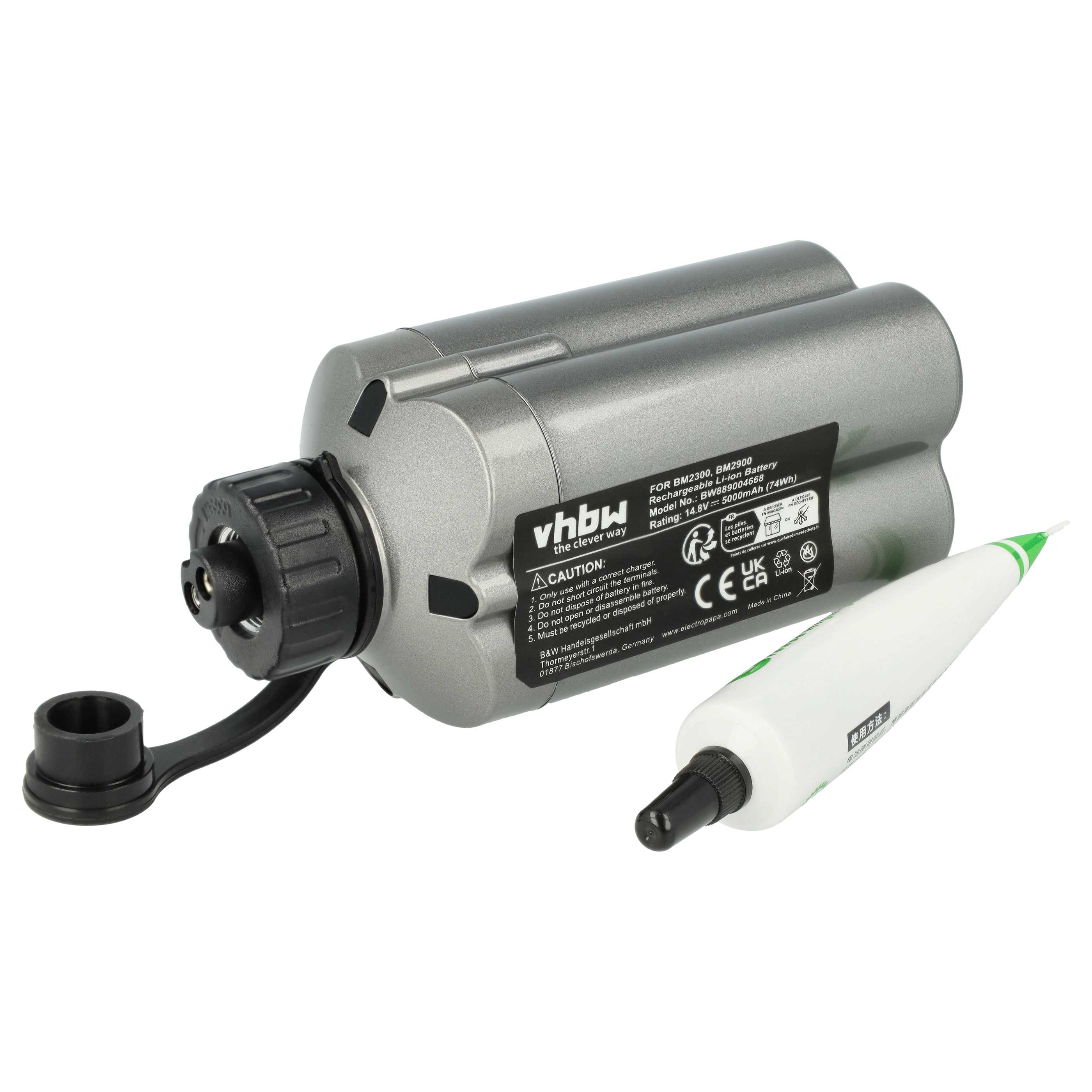 Grauer Akku mit schwarzem Stecker und weißer Tube mit grünem Aufdruck.