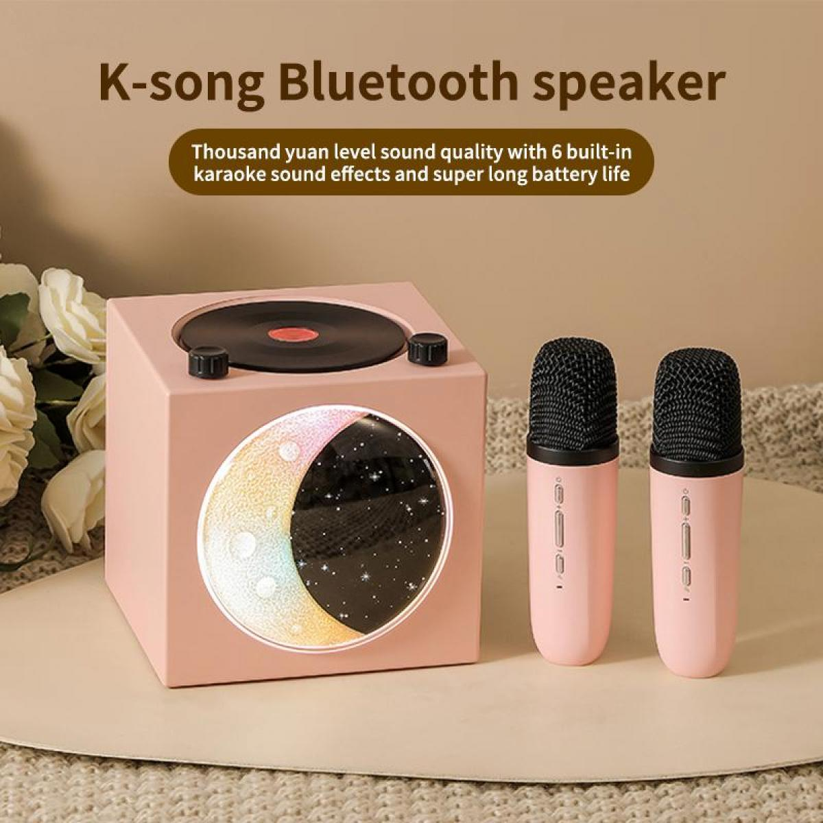 Ein rosafarbener K-Song Bluetooth-Lautsprecher mit Schallplatte und zwei Mikrofonen.